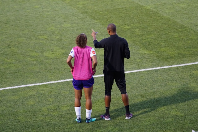 a coaching talking to a player