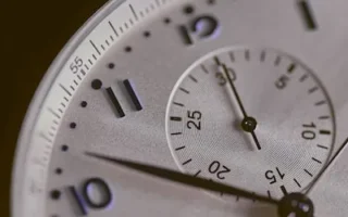 a close up of a silver watch face