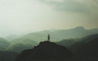 a person standing on mountain top
