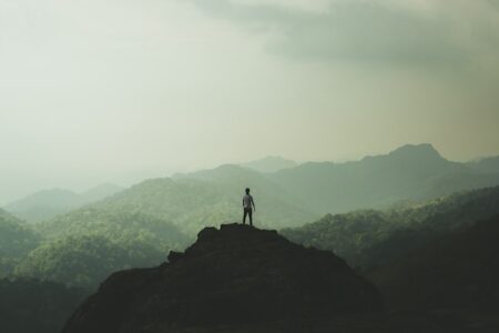 a person standing on mountain top